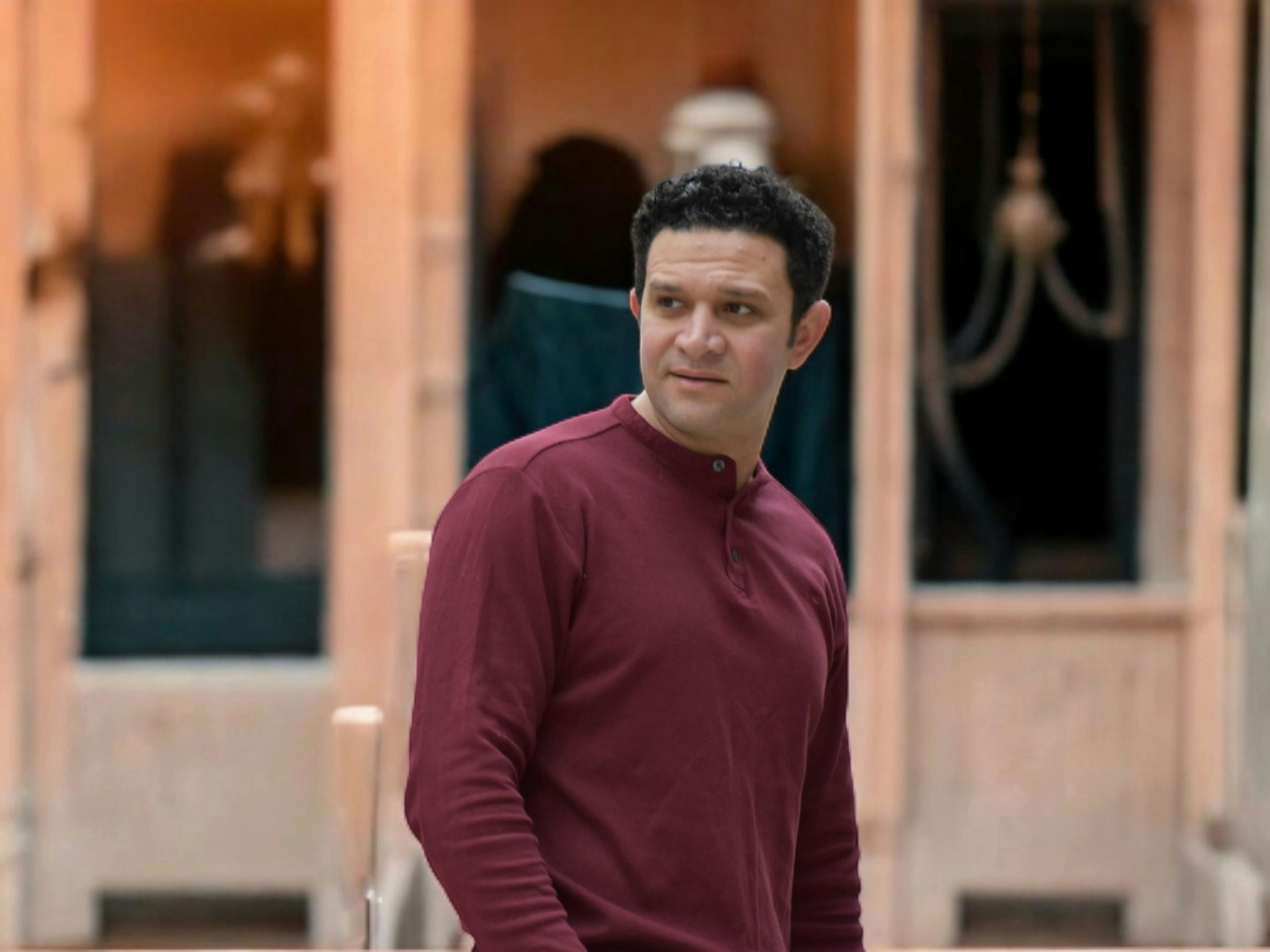 A man standing in front of a building