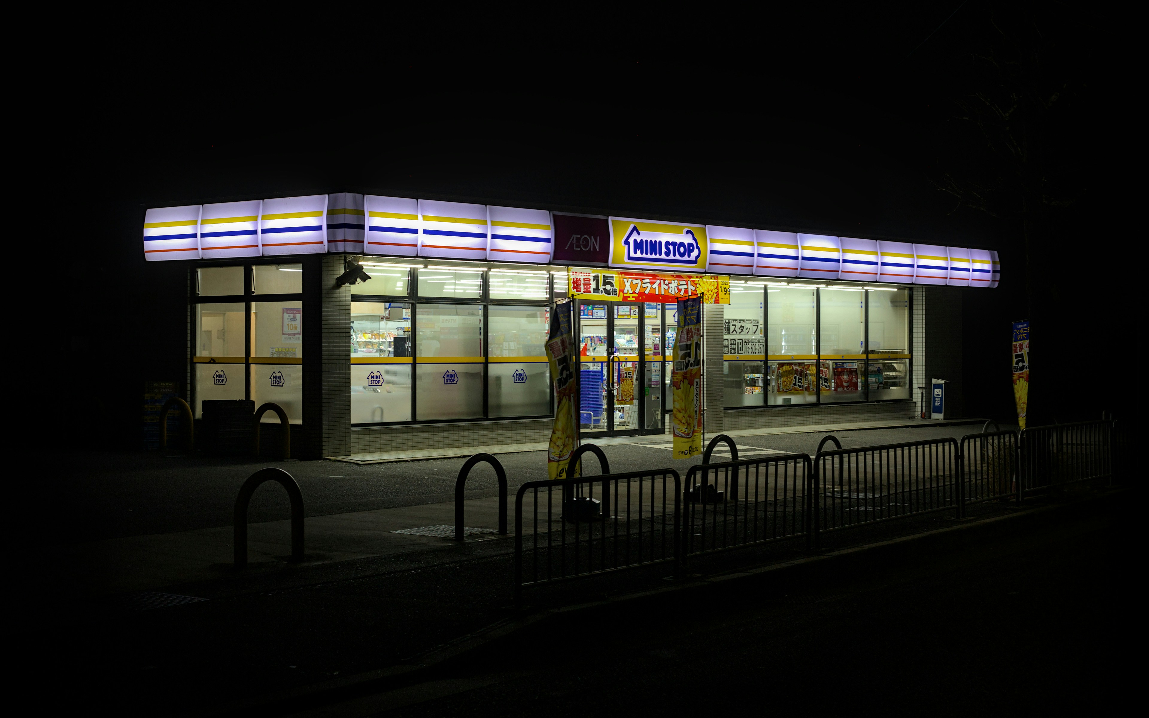 Electric SUV plugged into a fast charging station at night