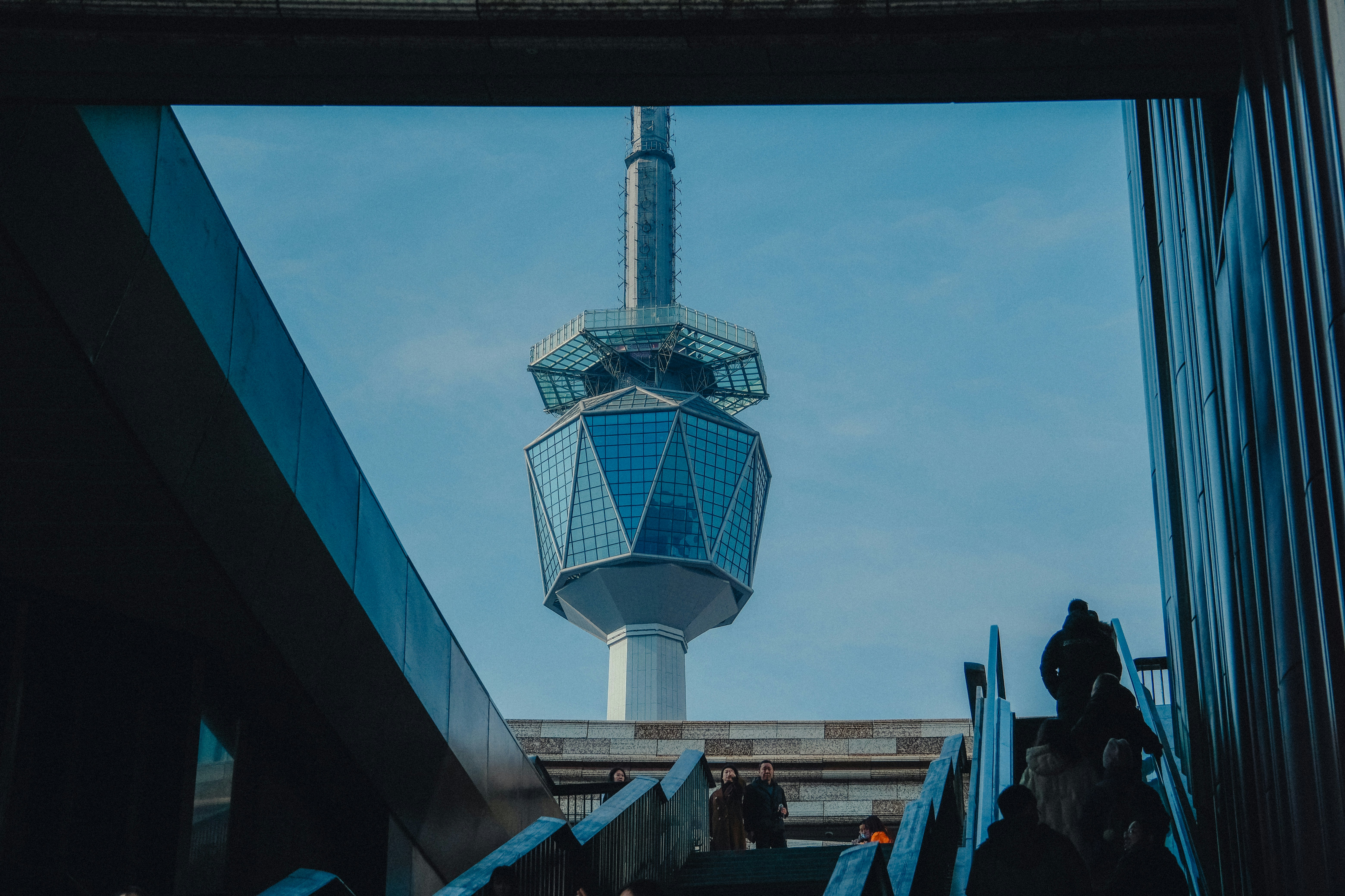 A view of a tall tower from a window photo – Free Building Image on ...