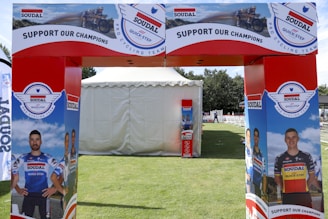 A red and white archway with a picture of a man on it