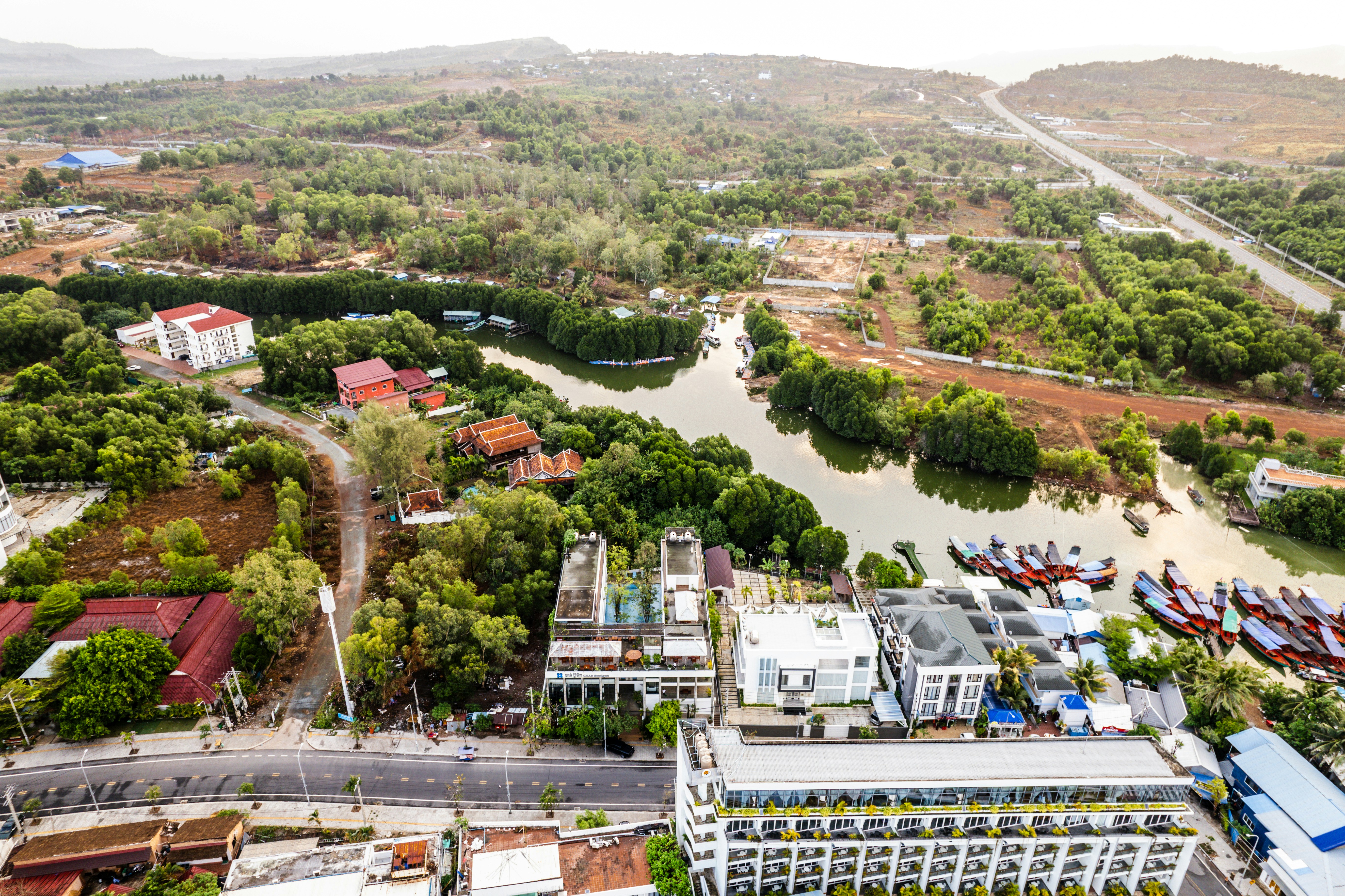 An aerial view of a city with a river running through it