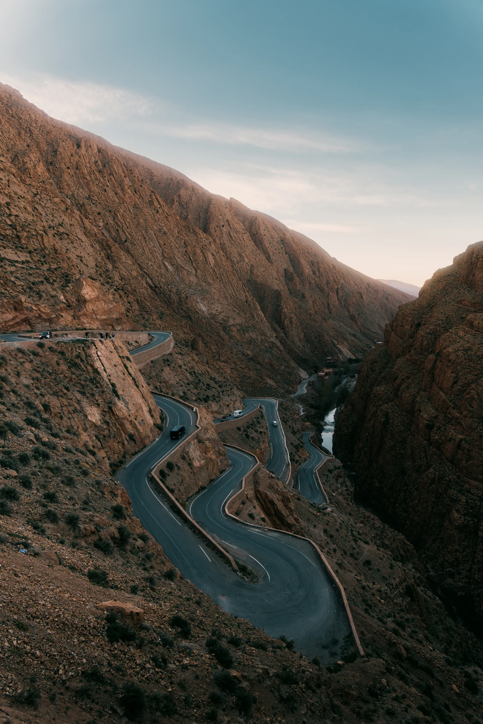 A winding road curving through steep mountain terrain