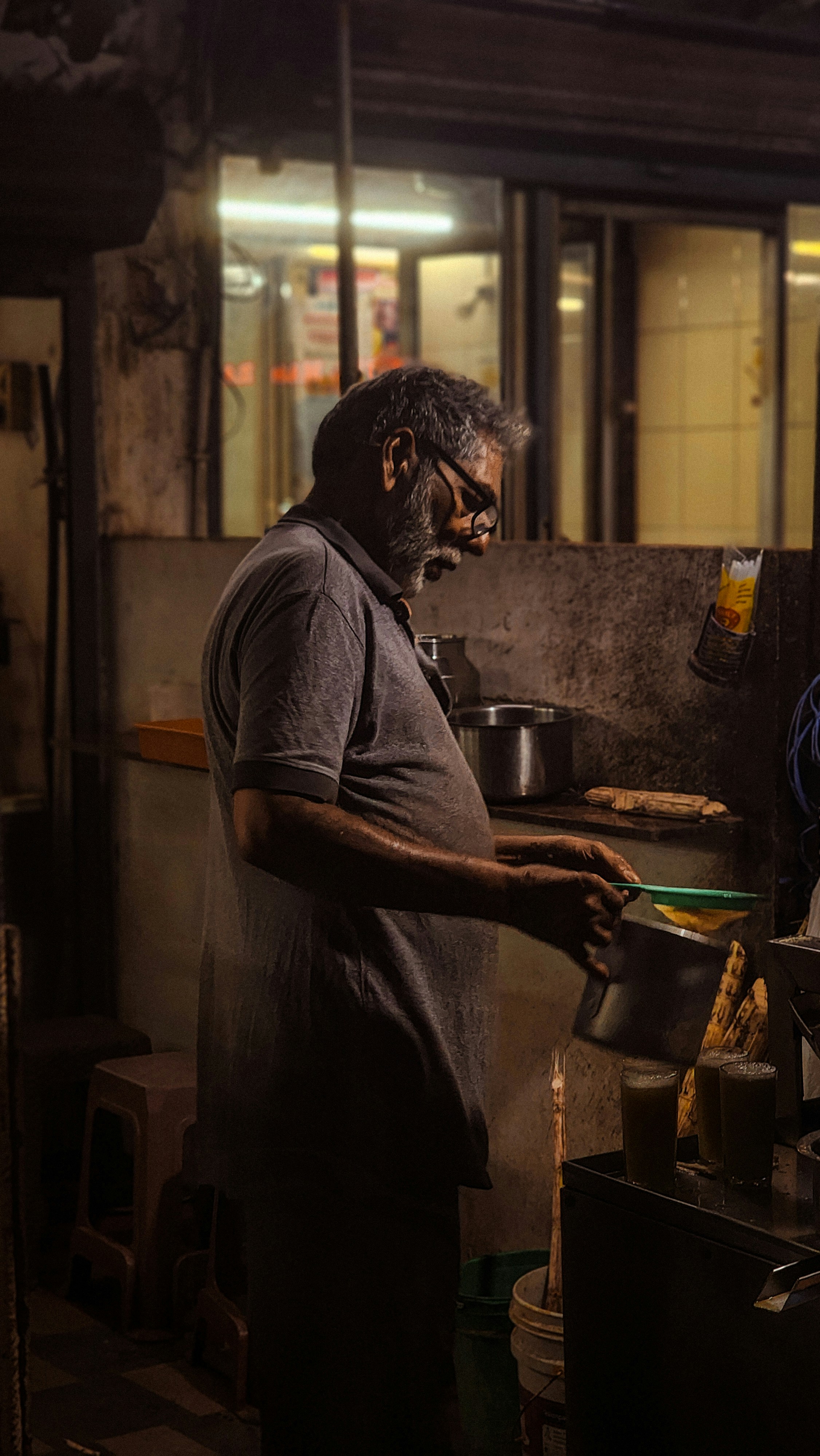 A man standing in a kitchen preparing food