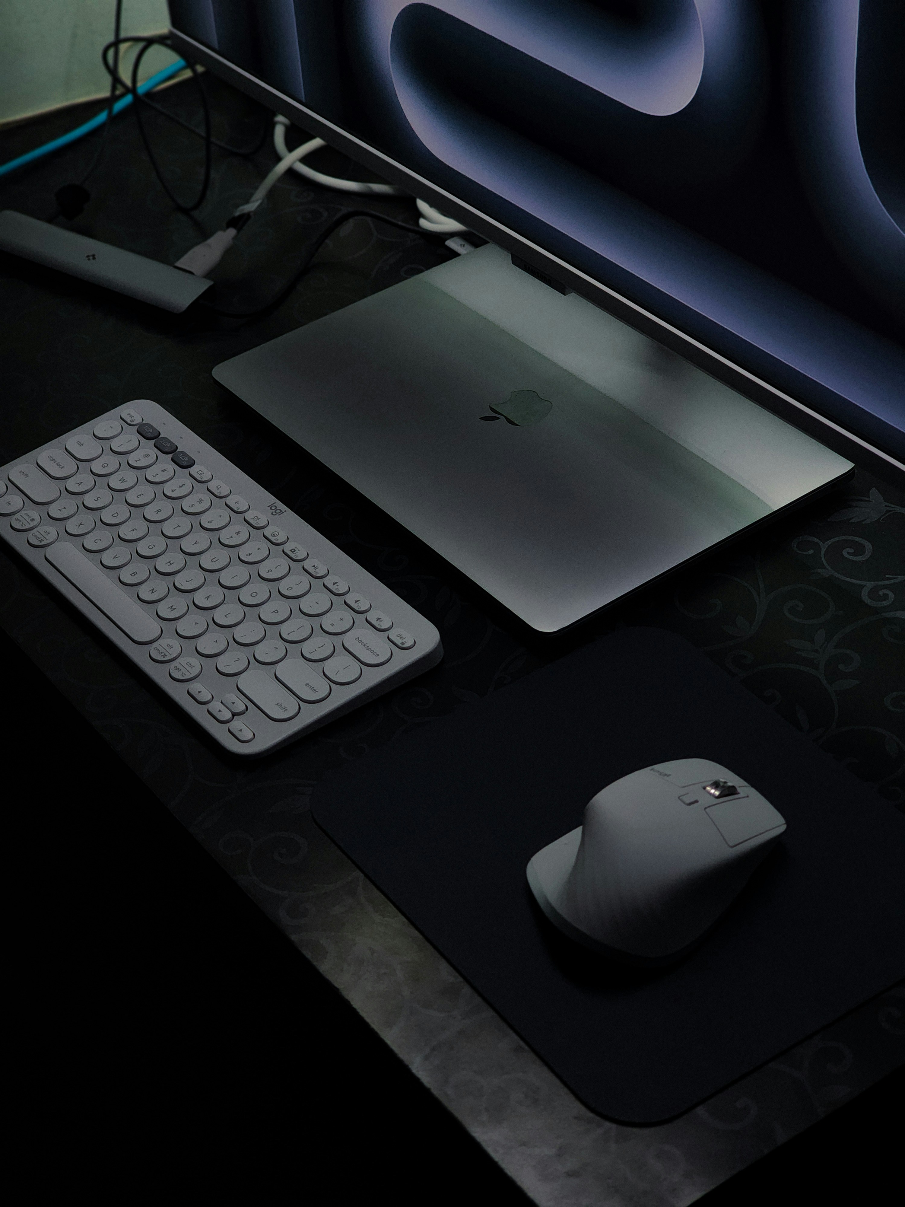 A computer desk with a keyboard and mouse