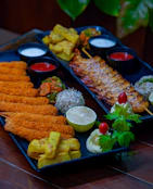 A platter of food on a wooden table