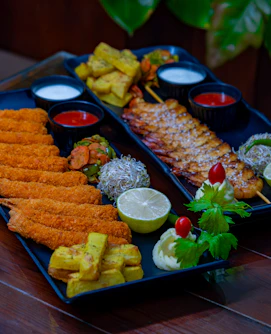 A platter of food on a wooden table