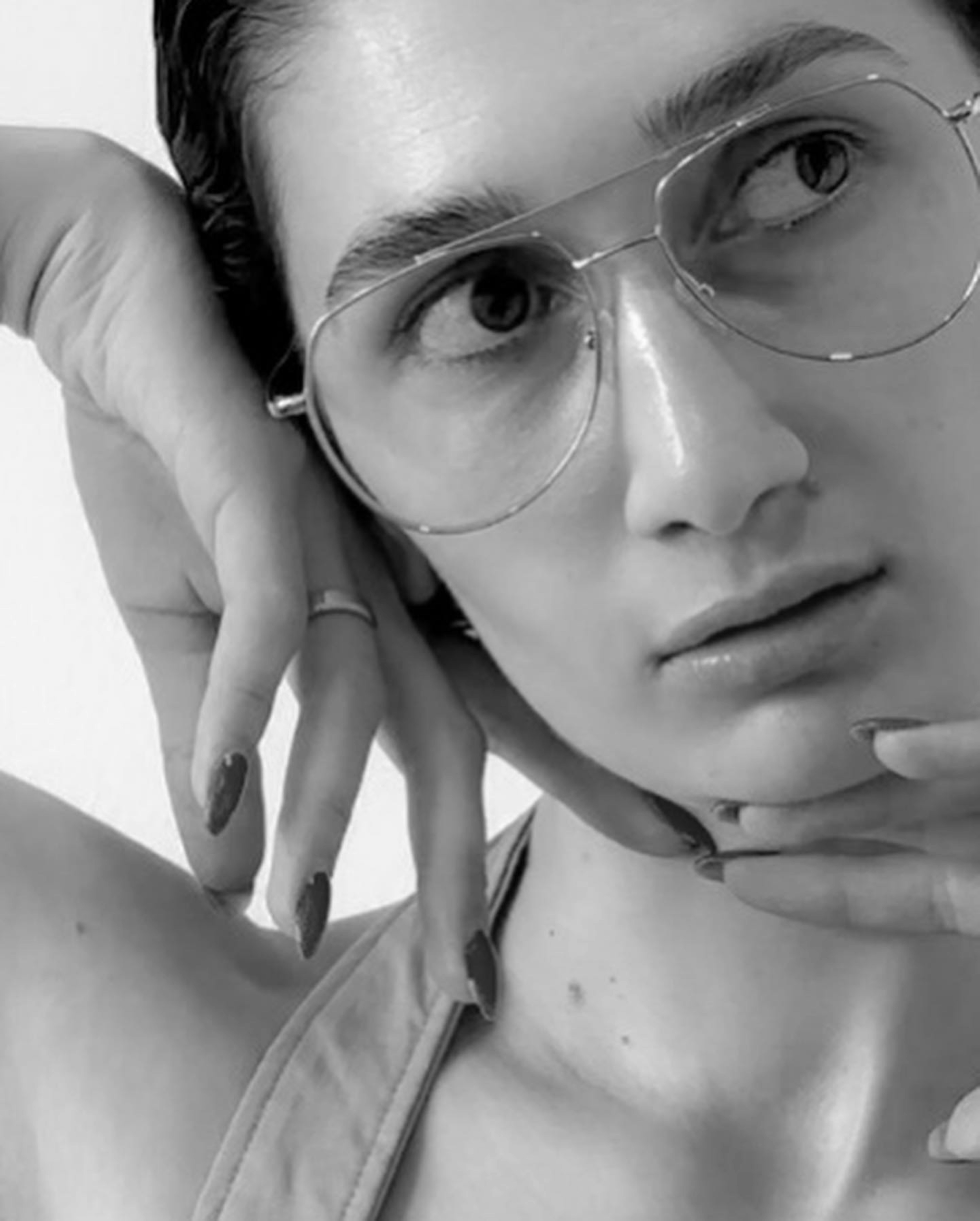 A woman wearing glasses is posing for a picture photo – Free Head Image ...