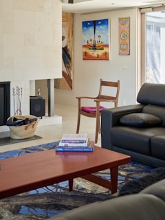 A living room filled with furniture and a fire place