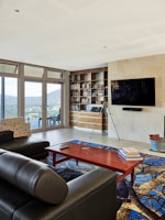 A living room filled with furniture and a flat screen TV