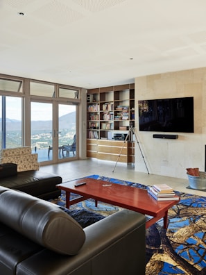 A living room filled with furniture and a flat screen TV