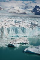 A large glacier with lots of snow on it