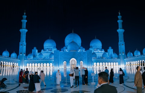 A group of people standing in front of a building
