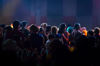 A crowd of people standing around a stage