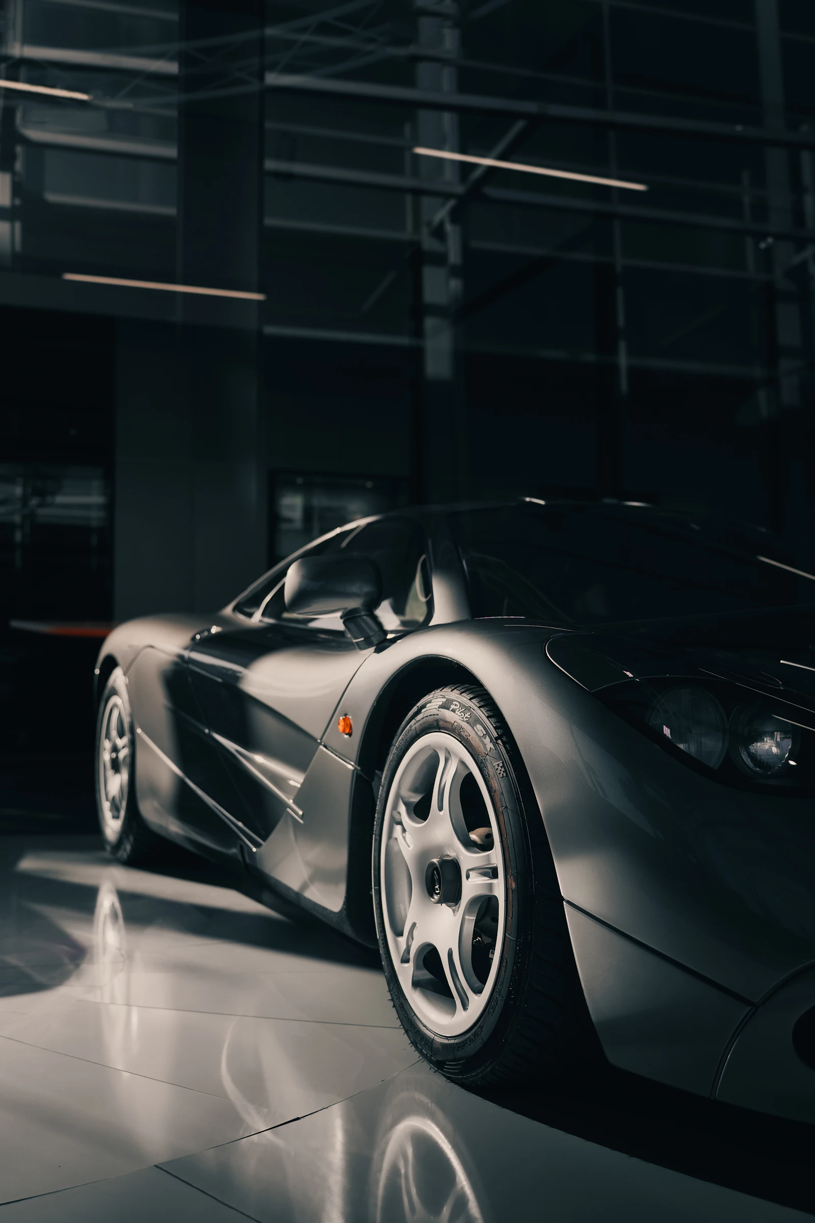 Silver sports car in a garage