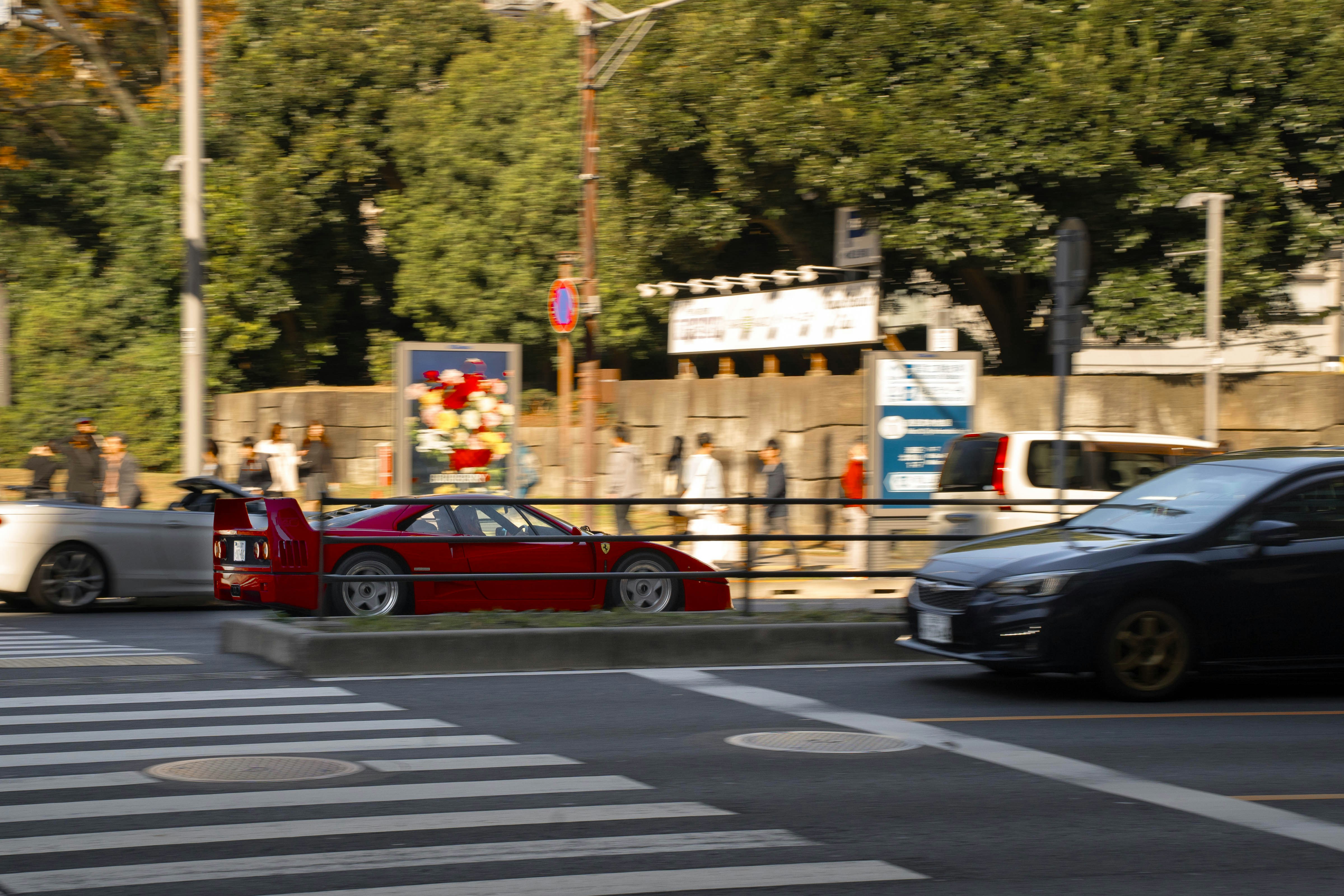 A couple of cars that are sitting in the street