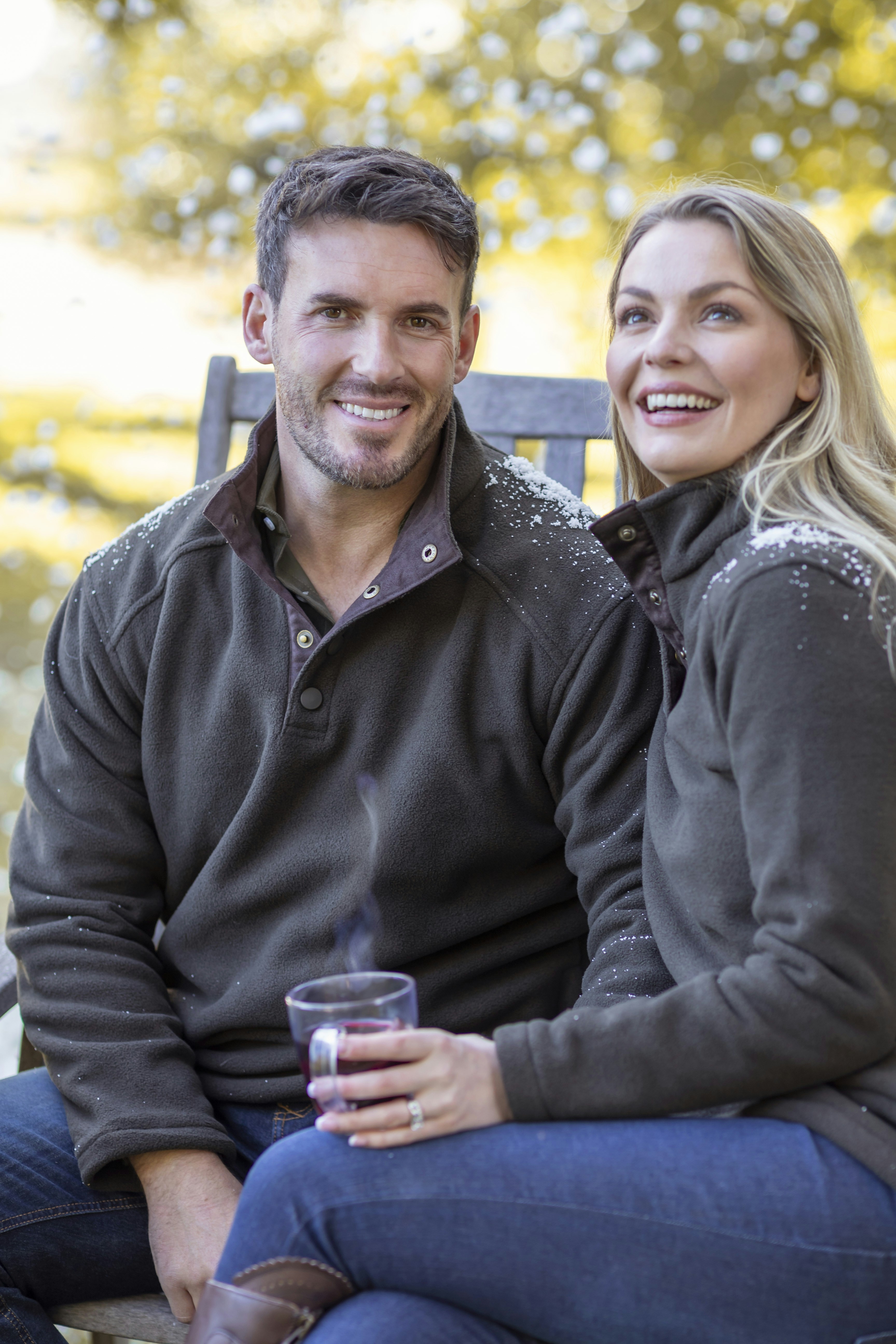 A man and a woman sitting on a bench