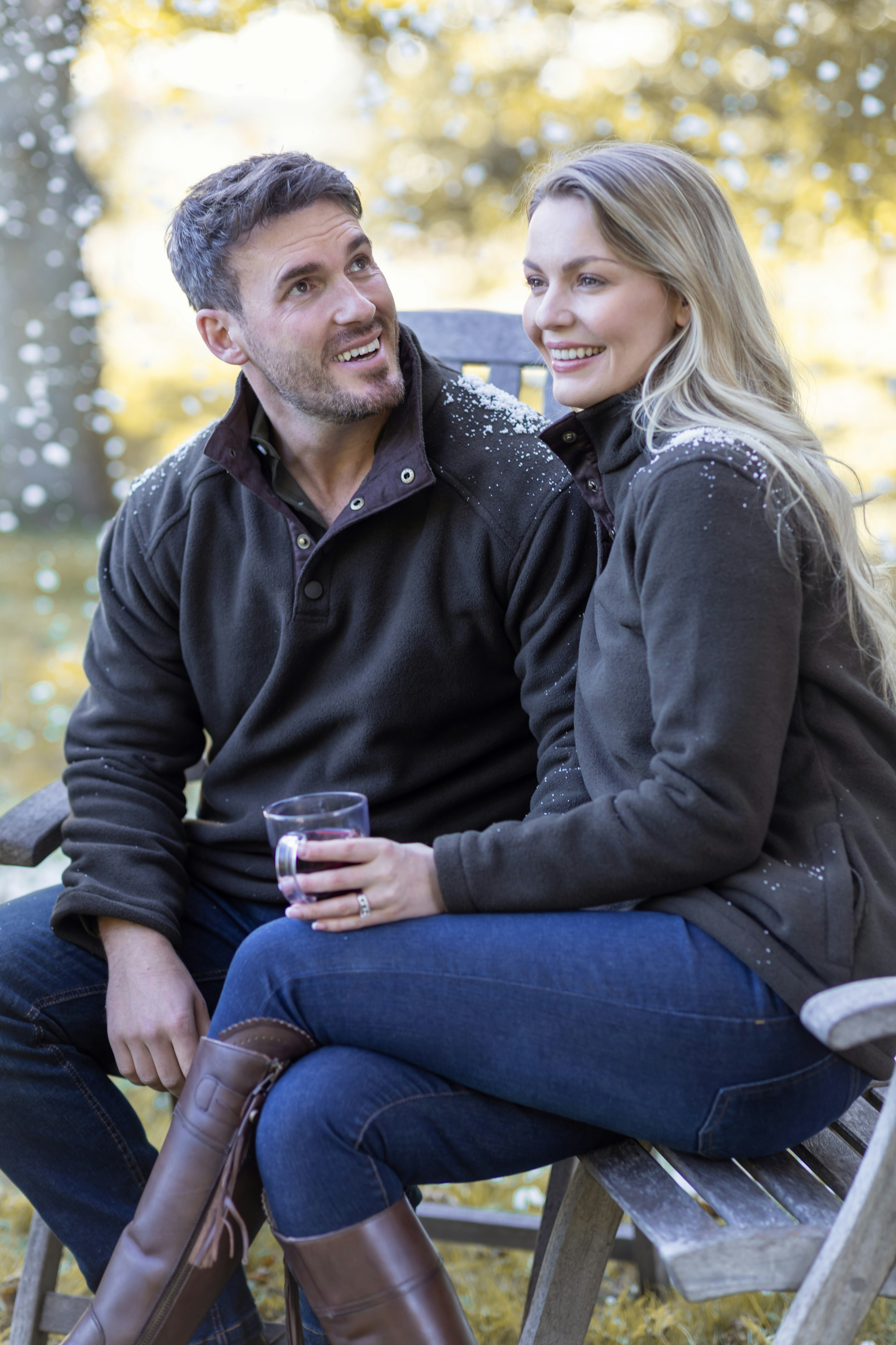 A man and a woman sitting on a bench