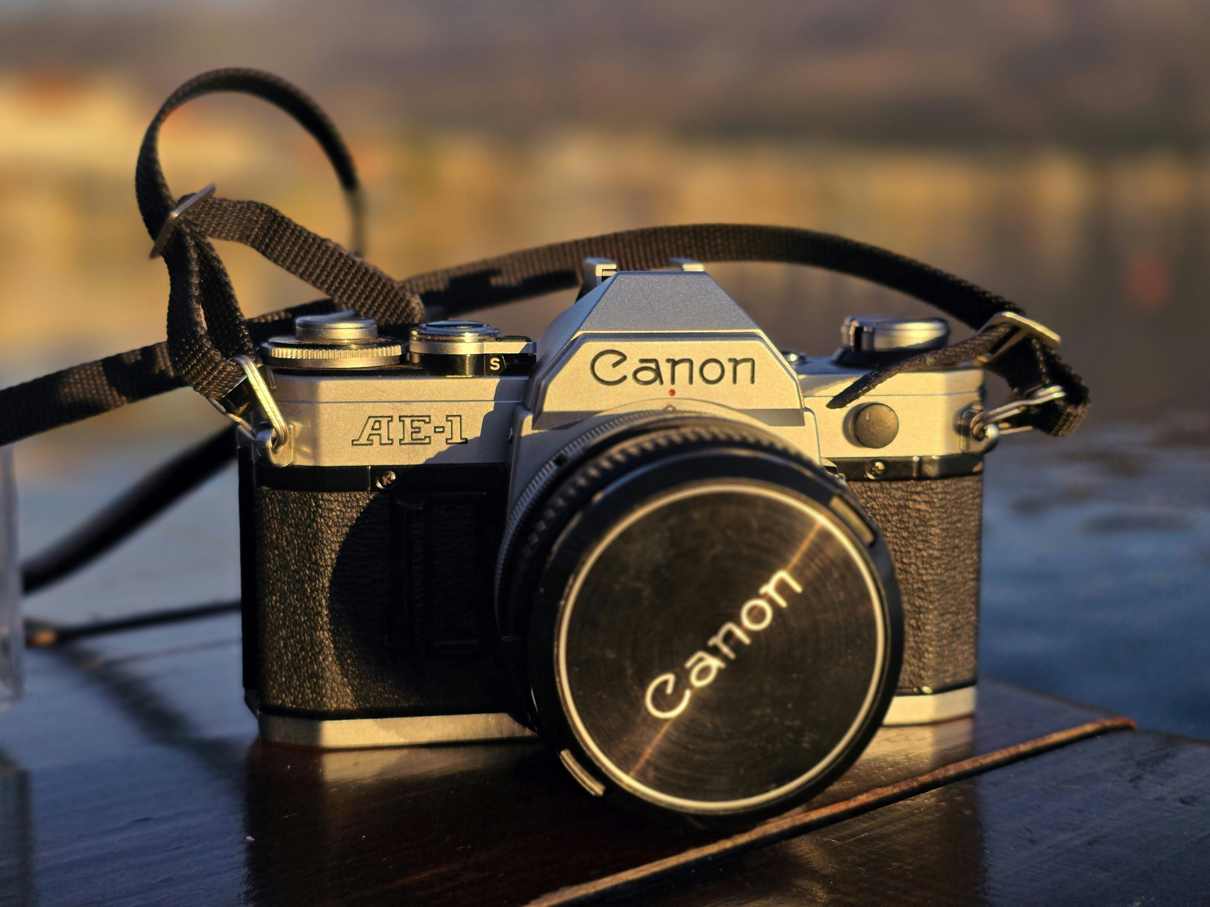A camera sitting on top of a wooden table