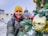 A man standing next to a christmas tree
