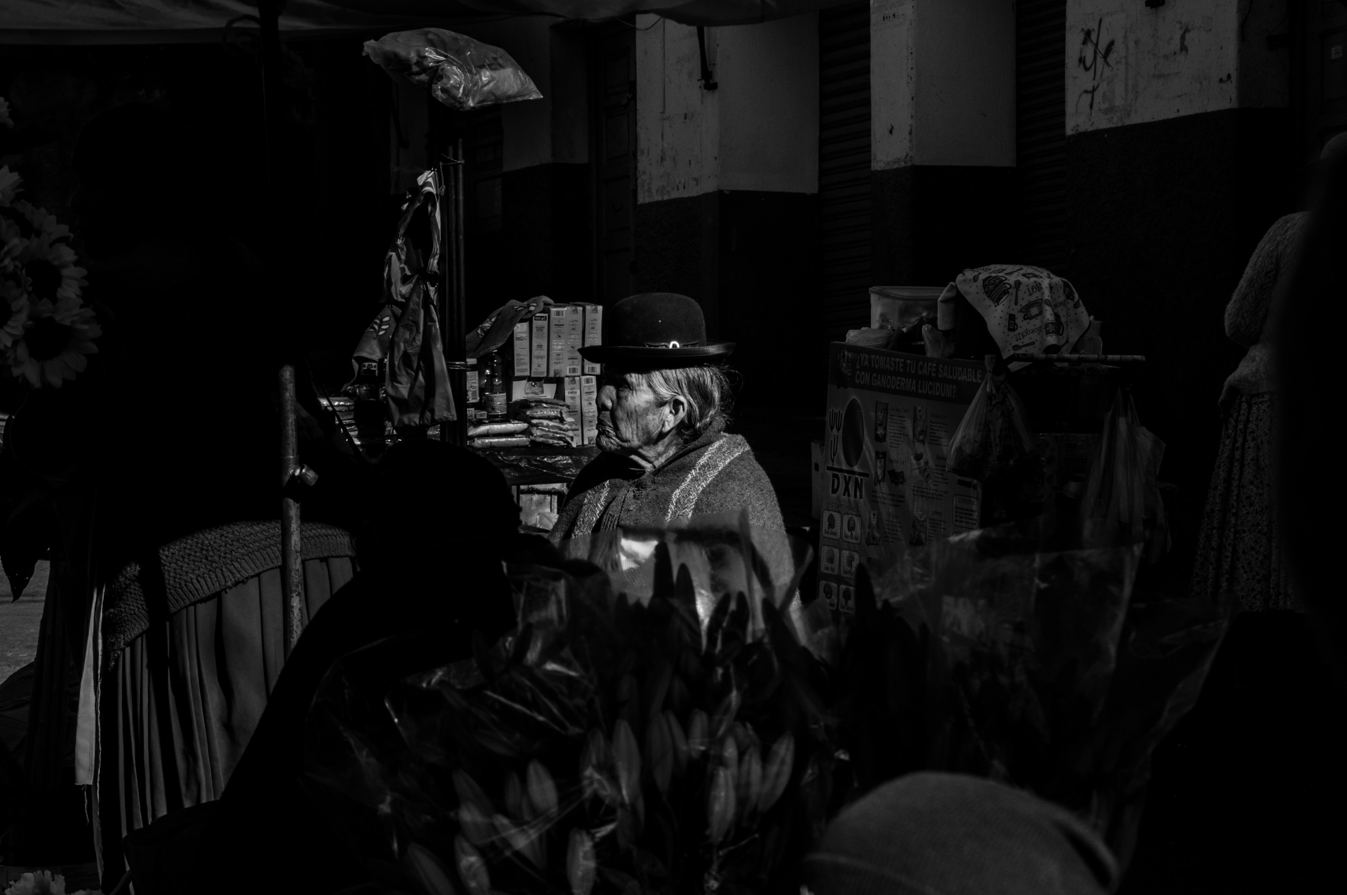 A black and white photo of a man in a hat