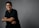 A man in a black shirt is posing for a picture