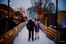 A couple of people that are standing in the snow