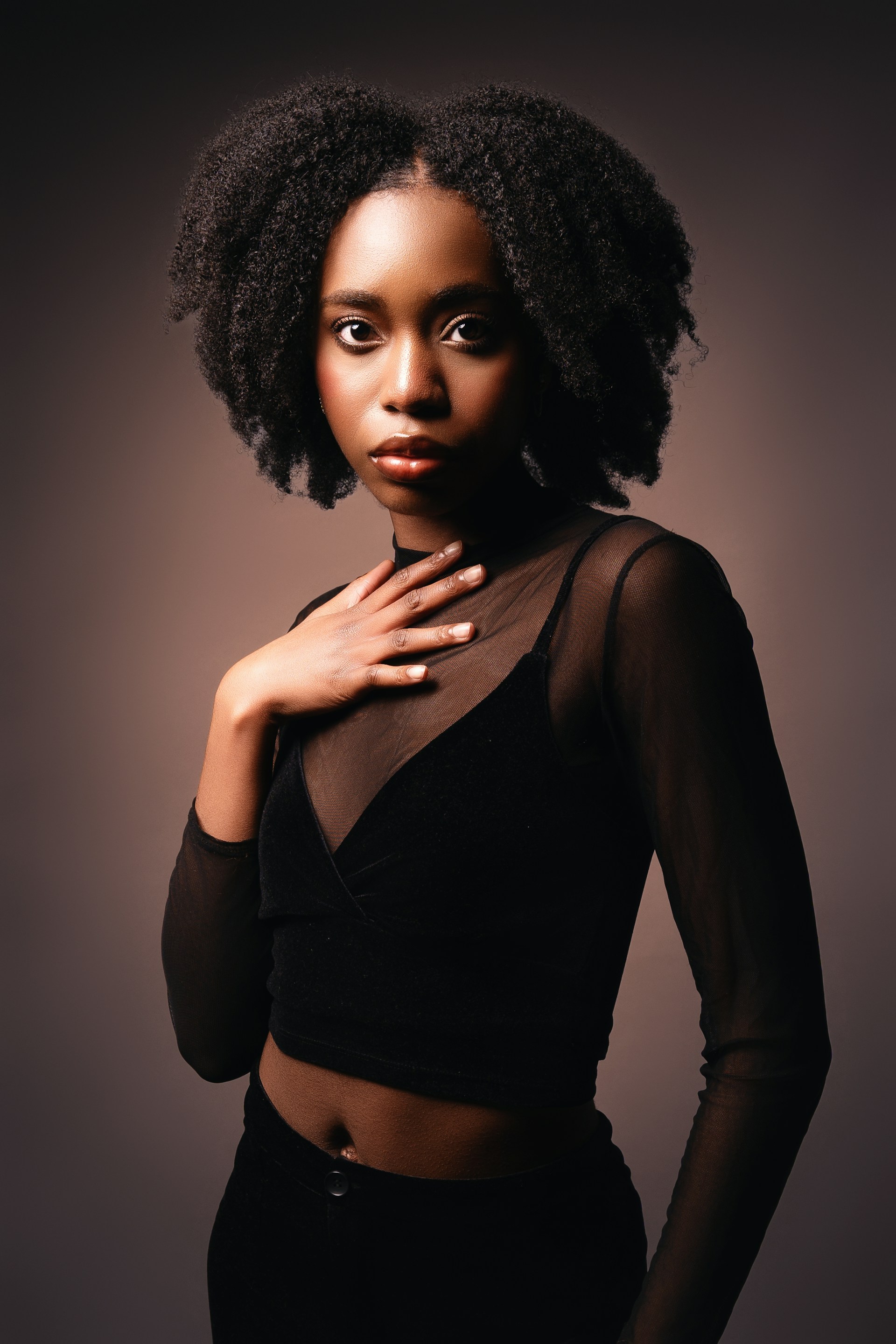 A woman in a black top posing for a picture