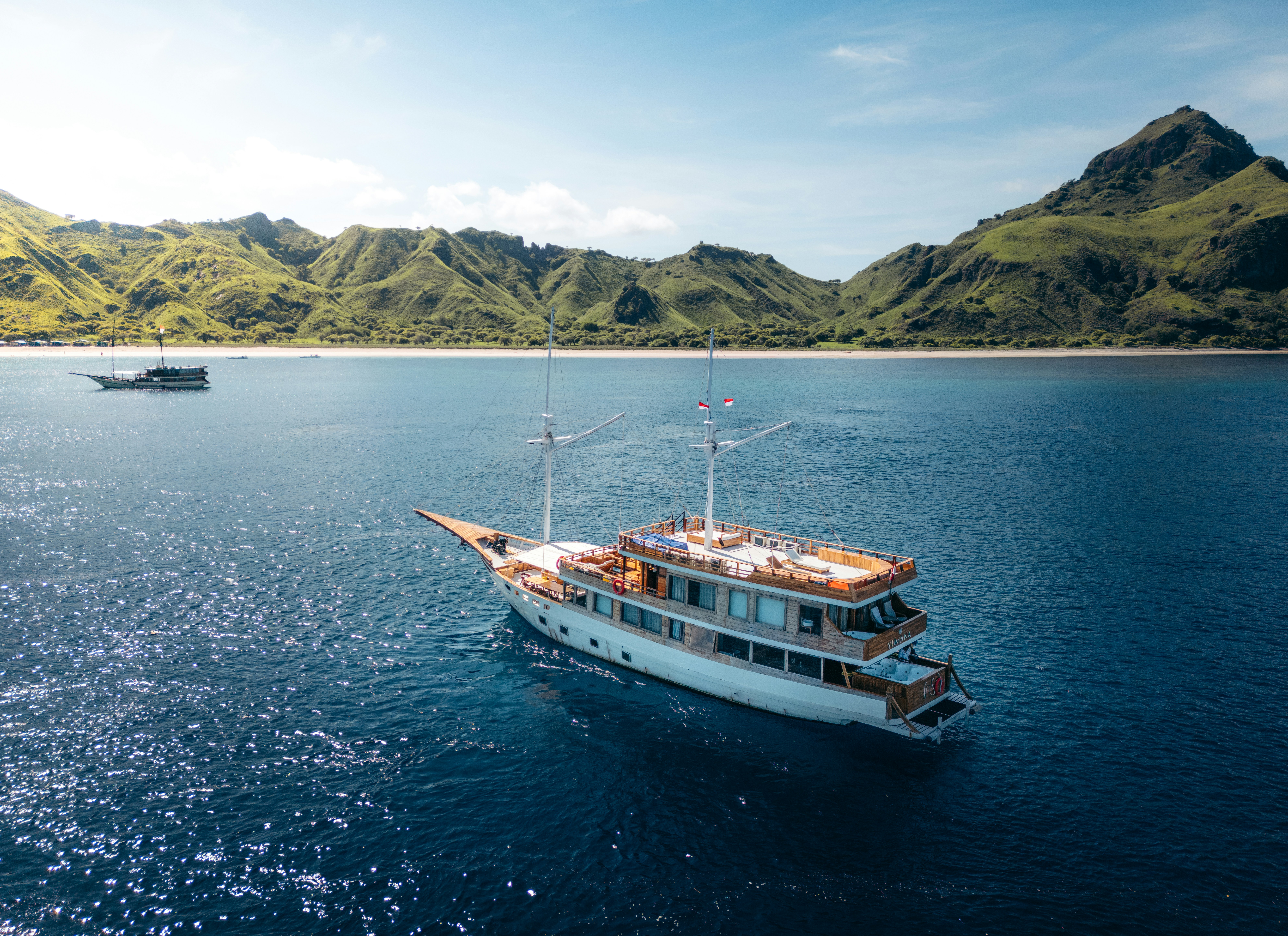 A large boat floating on top of a large body of water