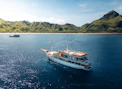 A large boat floating on top of a large body of water