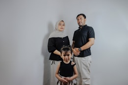 A family posing for a picture in a studio