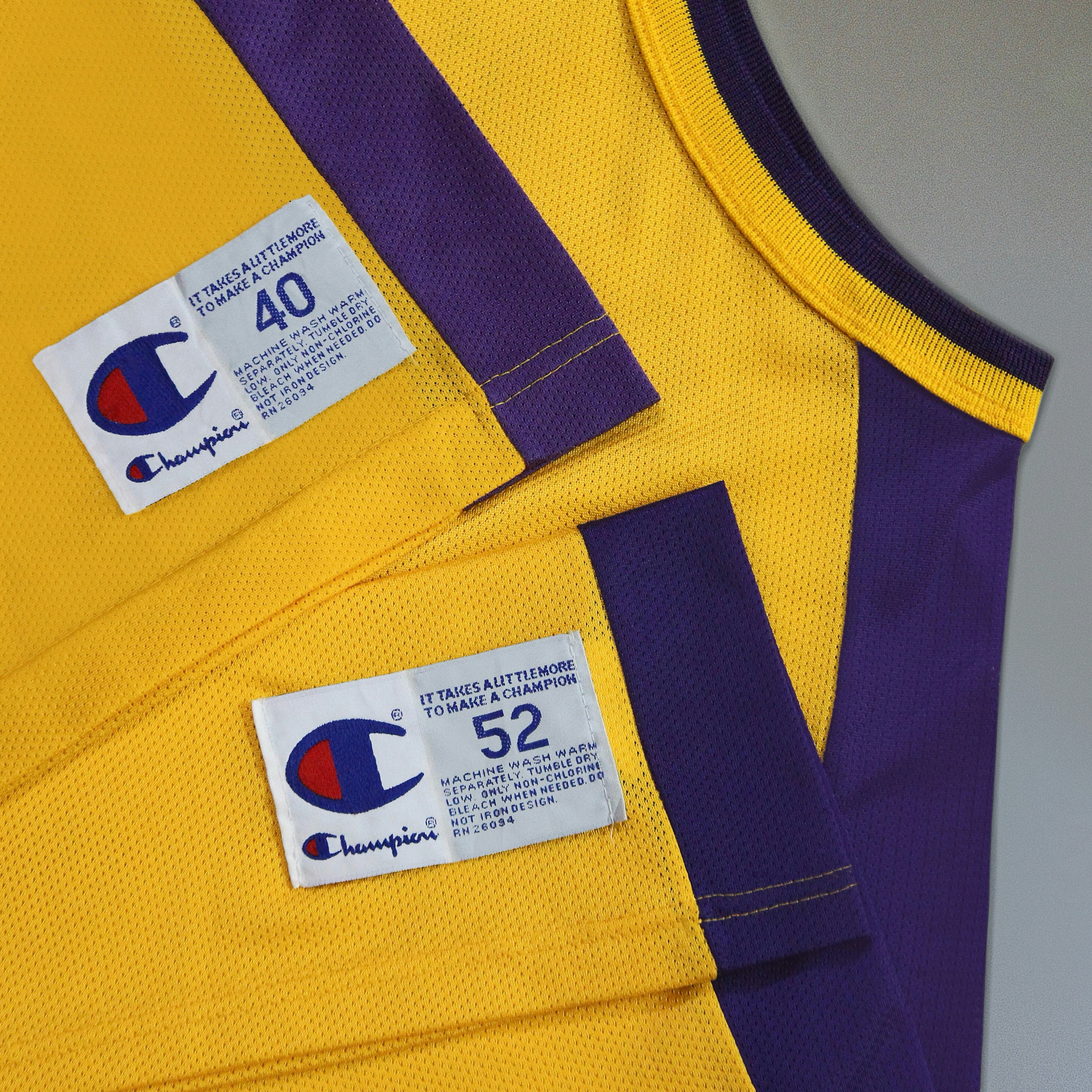 A yellow and purple jersey with a purple stripe
