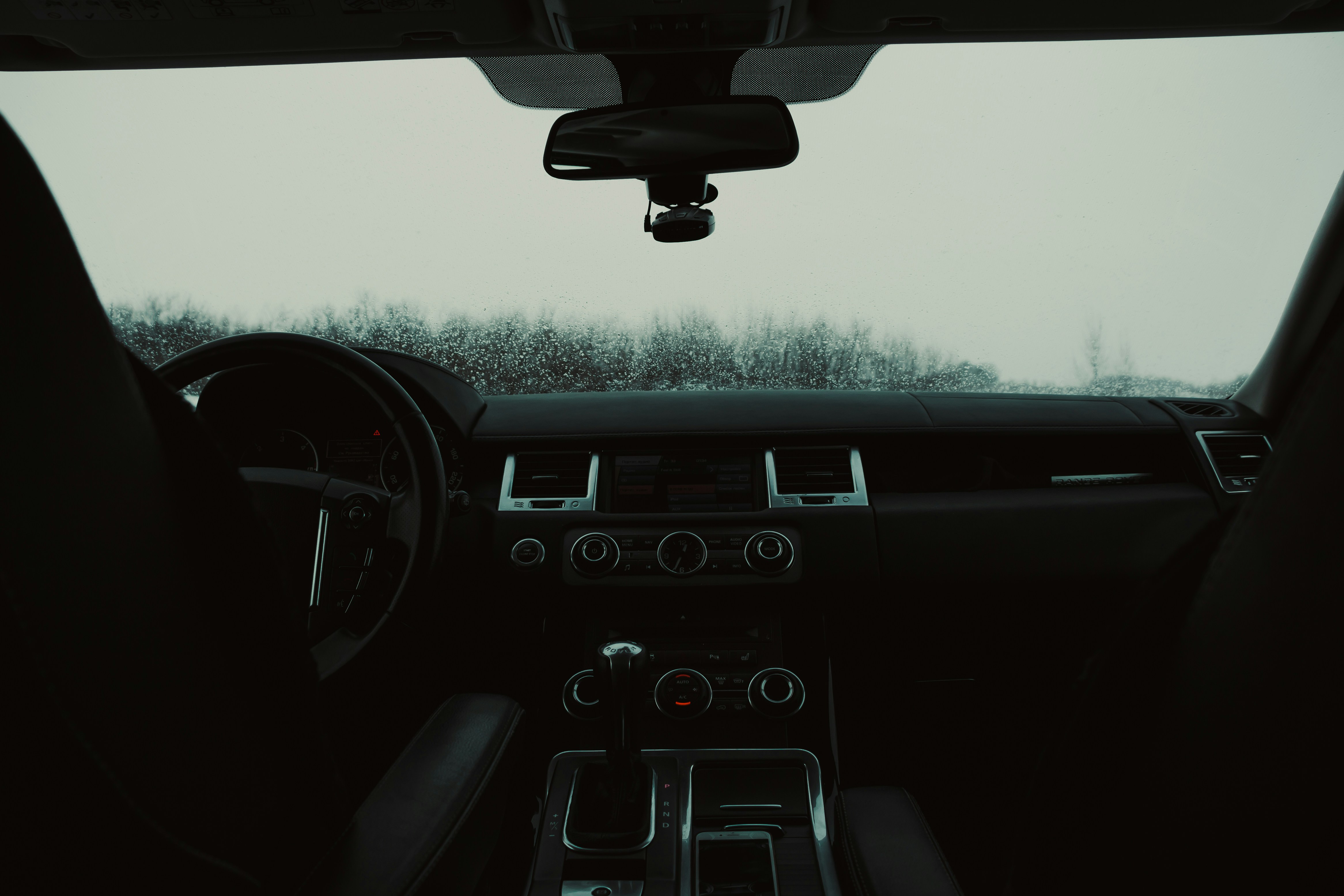 A view of the dashboard of a car from inside the vehicle