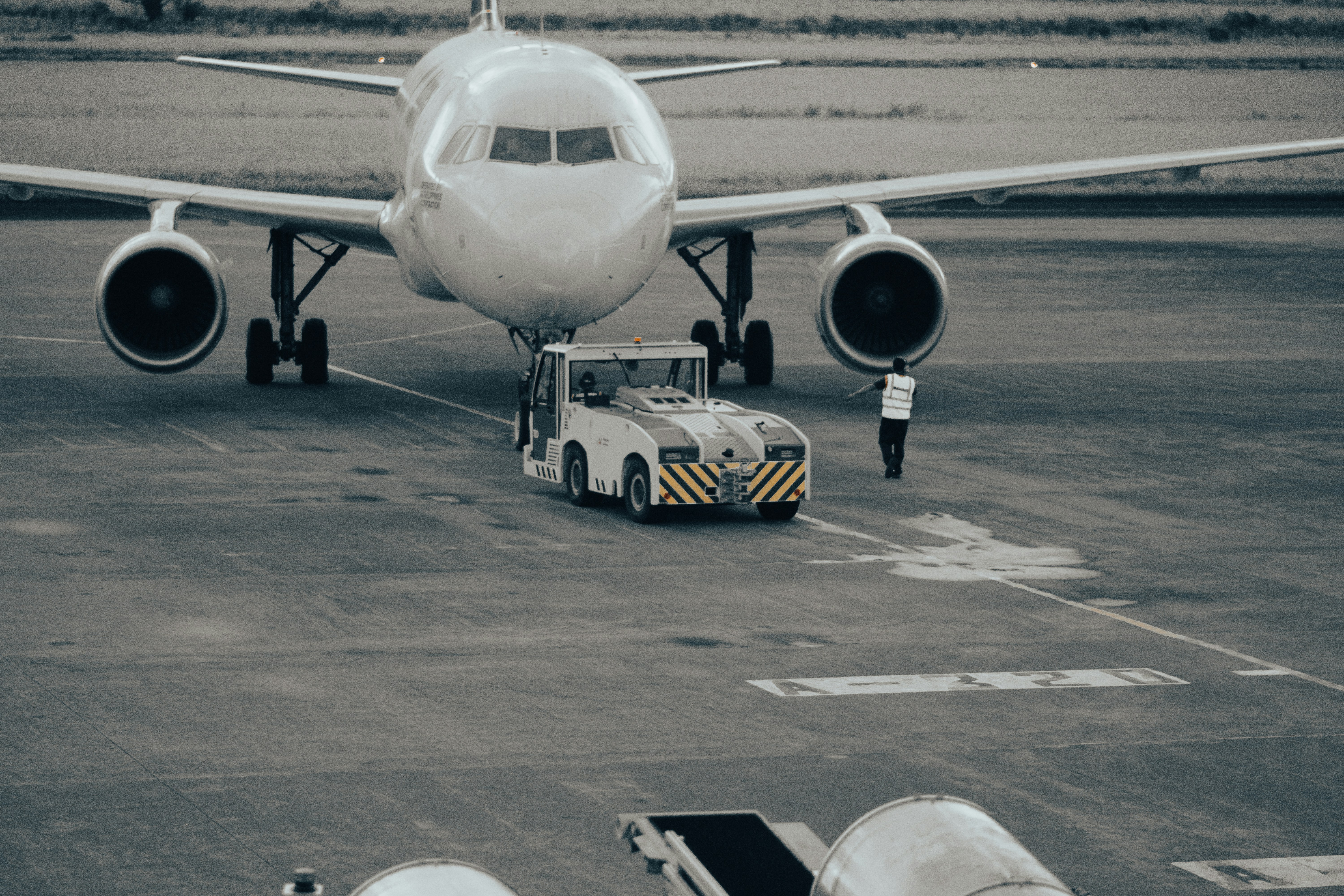 A large jetliner sitting on top of an airport tarmac