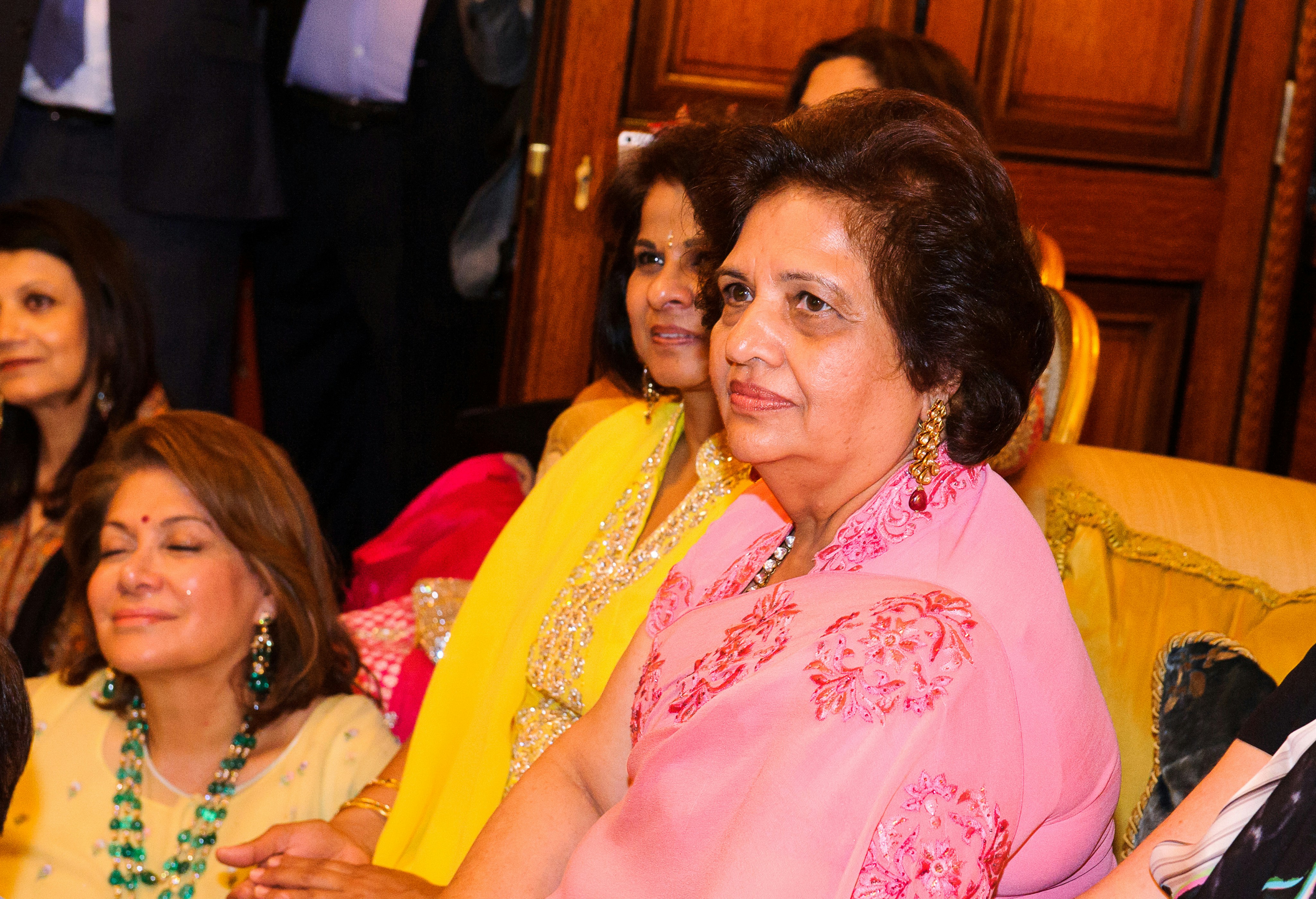 Taranjit Singh Sandhu in a formal suit, perhaps shaking hands with a foreign dignitary or giving a speech at a podium.