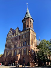 A tall building with a clock on the top of it