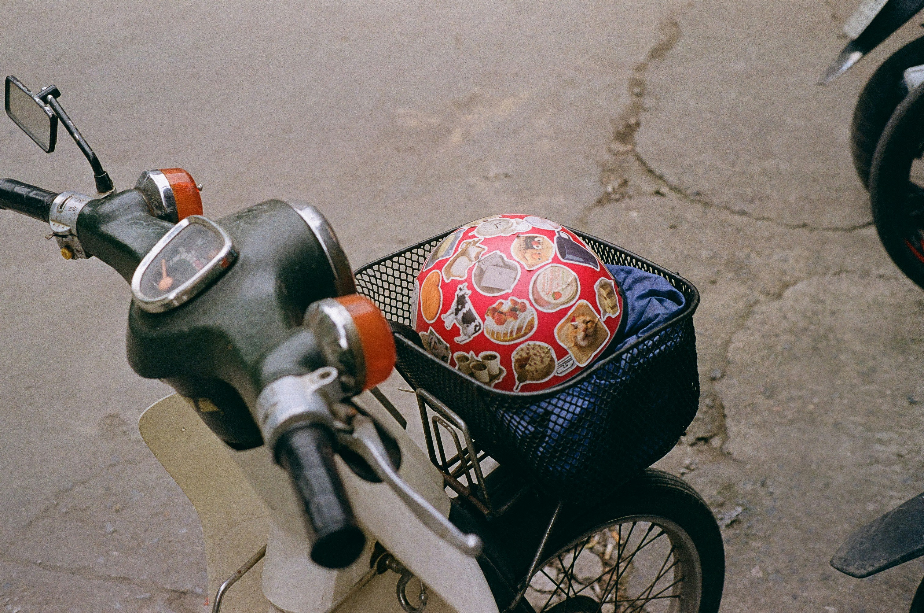 A scooter with a bag on the back of it