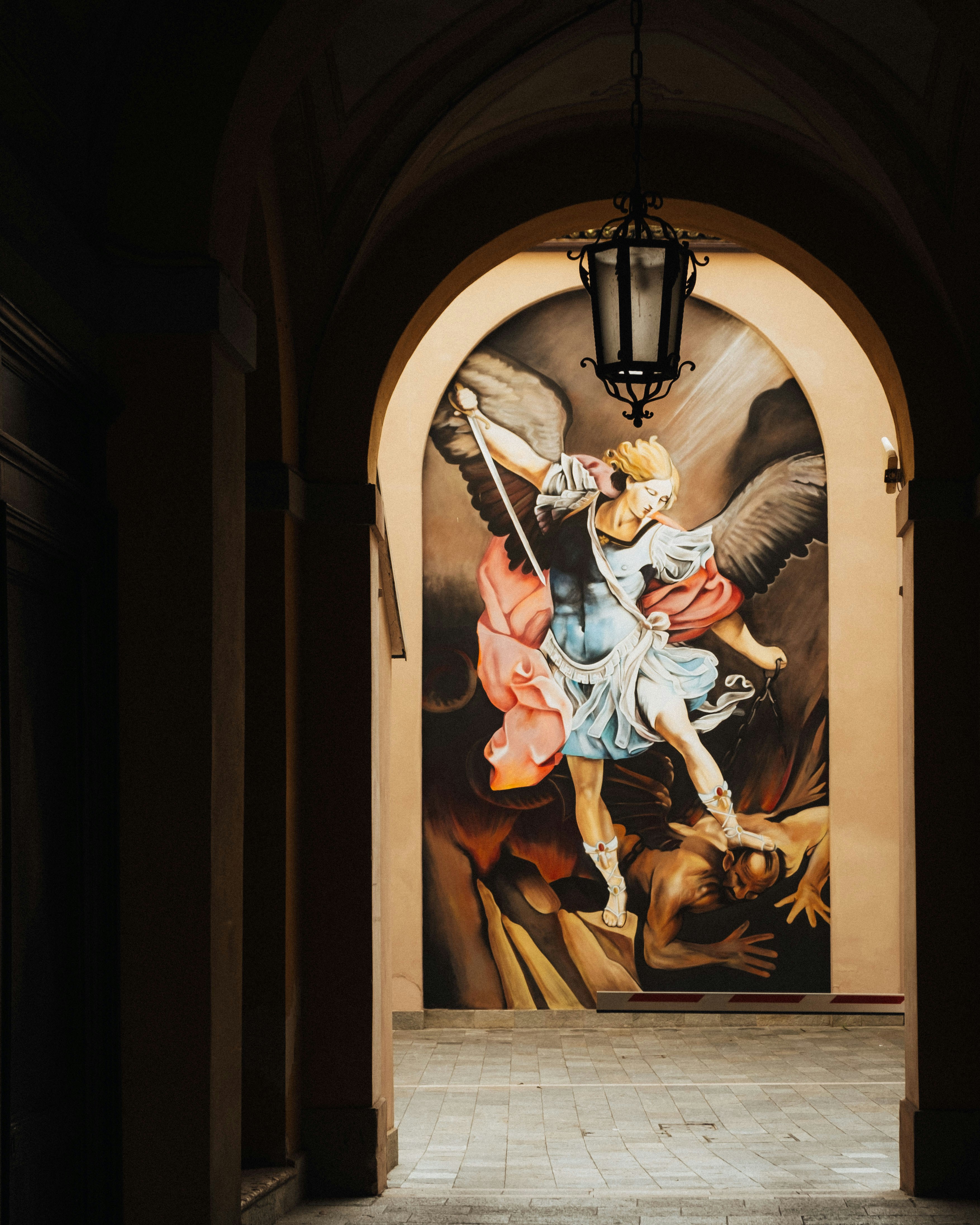 A hallway with a painting on the wall