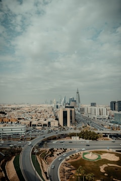 An aerial view of a highway and a city