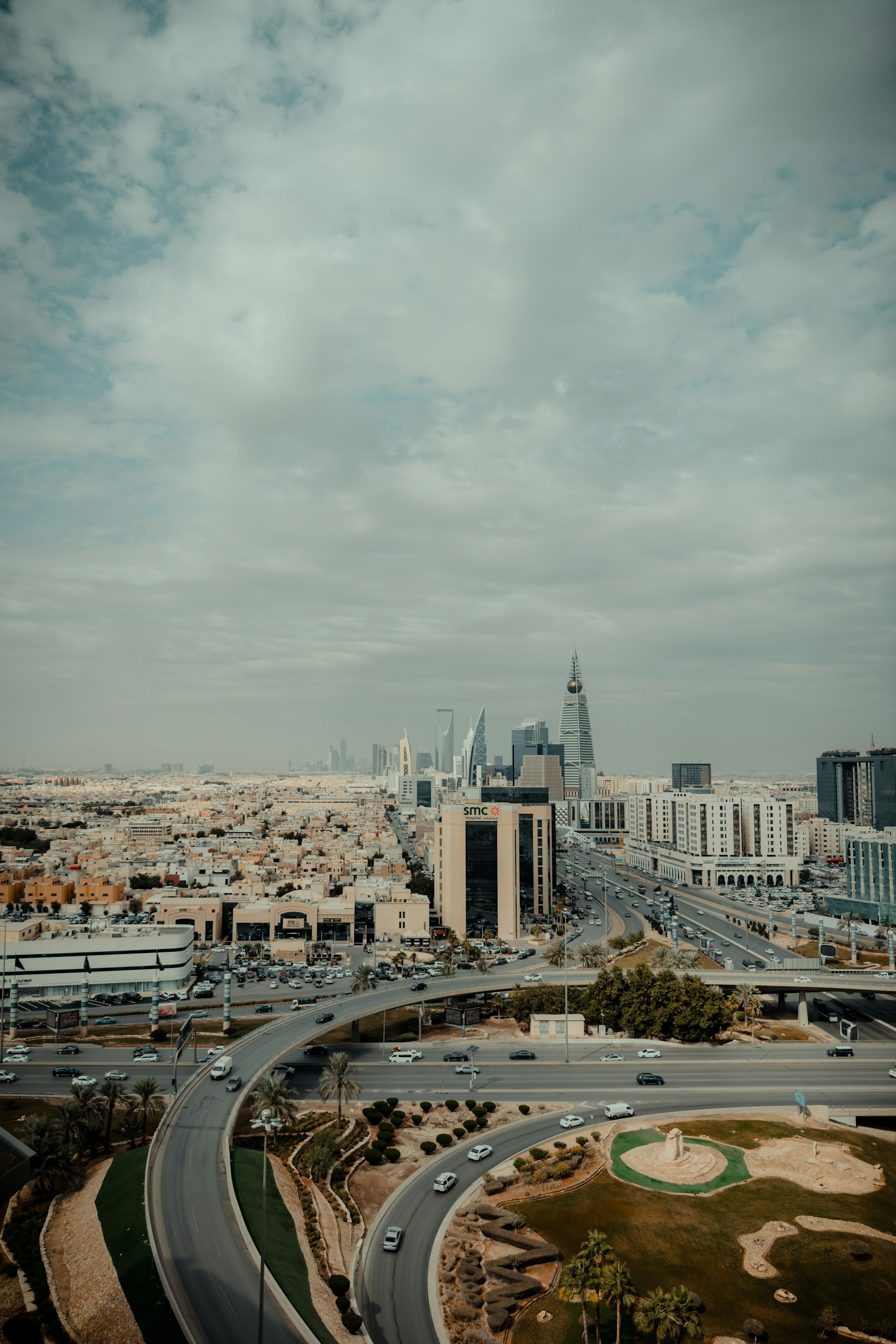 An aerial view of a highway and a city