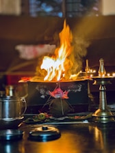 A table with a fire burning in the middle of it