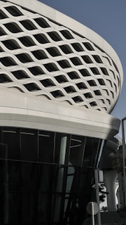 A large white building with a circular roof