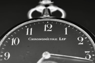 A black and white photo of a clock
