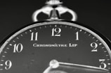 A black and white photo of a clock