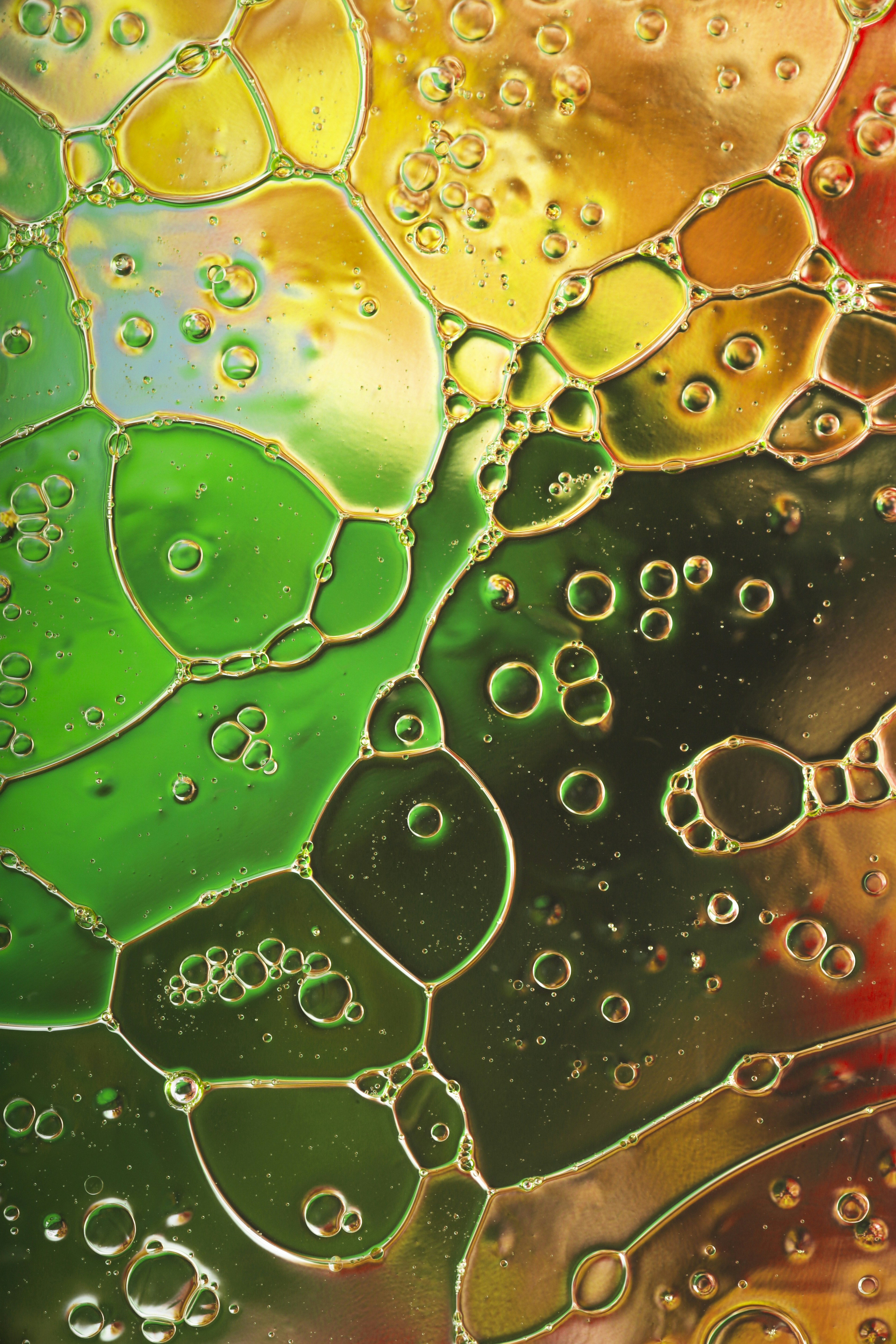 A close up of water bubbles on a colorful surface