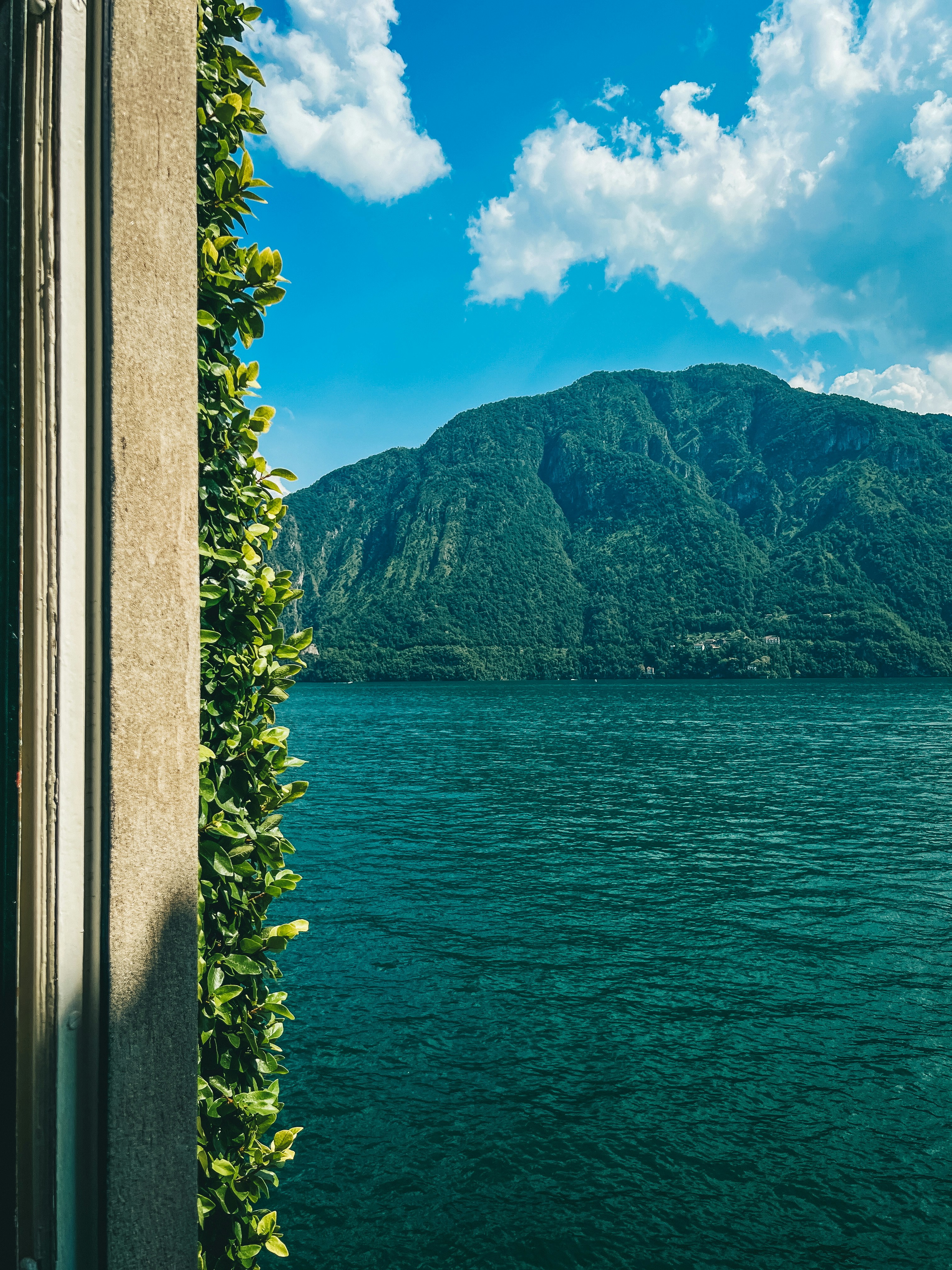 A view of a body of water with mountains in the background