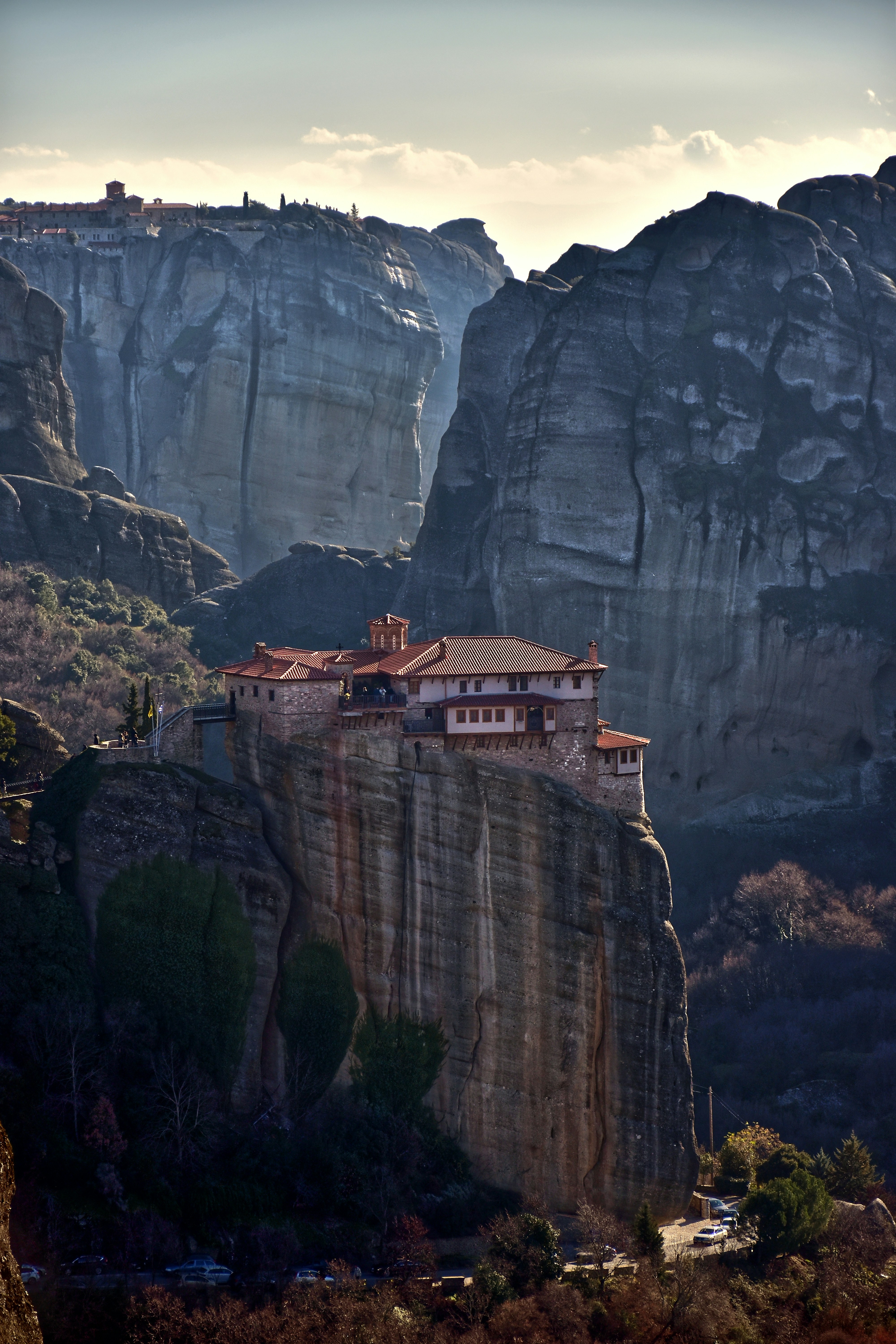 A house on top of a cliff in the mountains