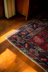 A wooden floor with a rug on top of it