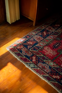 A wooden floor with a rug on top of it