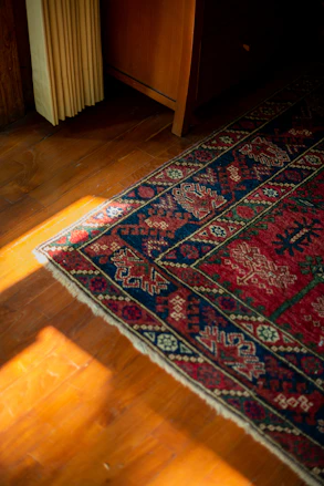 A wooden floor with a rug on top of it