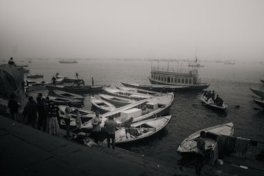 A black and white photo of boats in the water